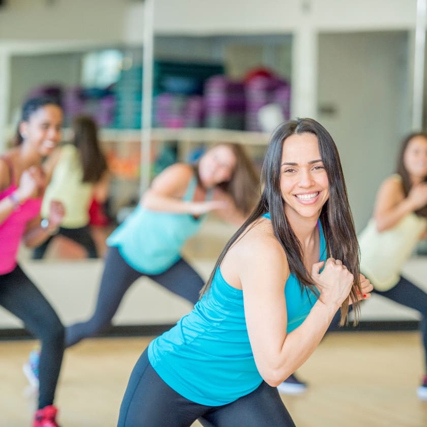 woman dancing at zumba class at pursuit fitness gym in monroe